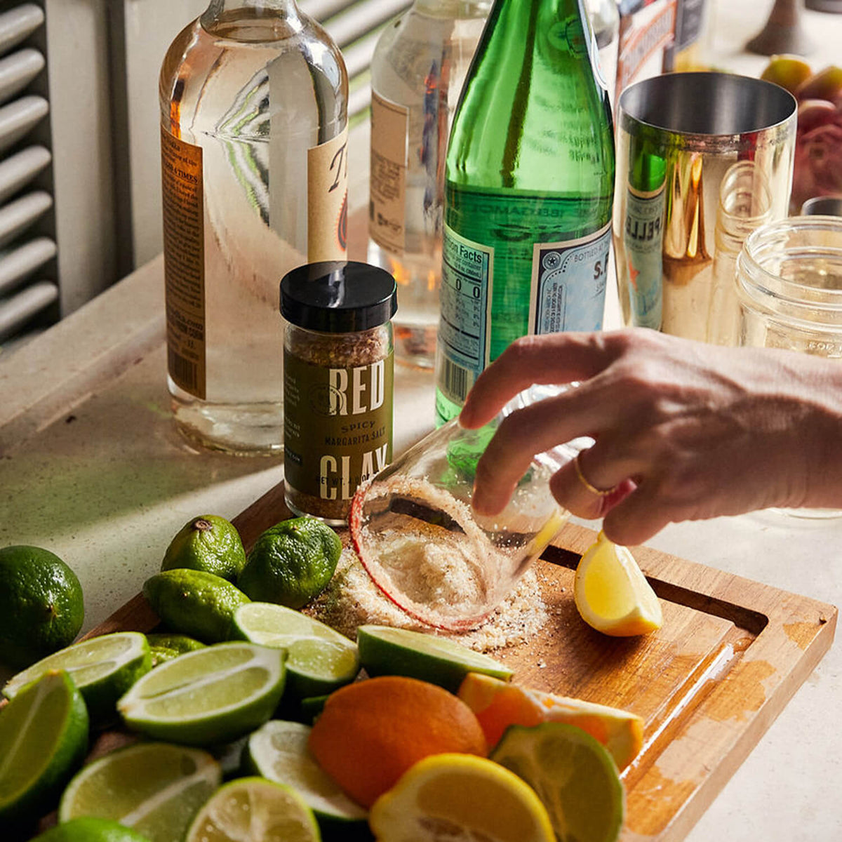 Dipping a glass into the spicy margarita salt